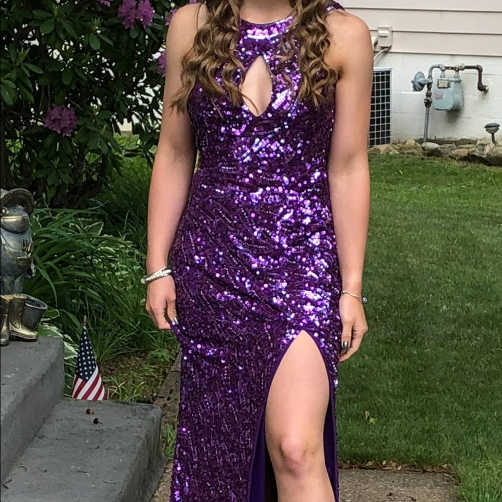 Stunning backless sequin gown by Cassandra Stone